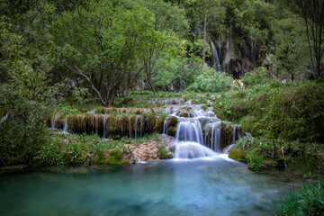 Obraz premium Scenic waterfalls of the source of the Cuervo River in the Serrania de Cuenca natural park in Cuenca, Spain