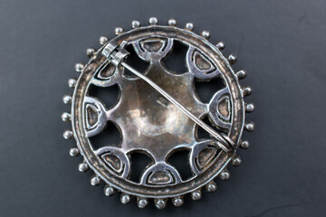 Statement crystal brooch on a black background, vintage jewelry concept, promotional photo for an online jewellery store