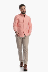 Fototapeta premium sexy unshaved guy in plaid shirt looking away and walking