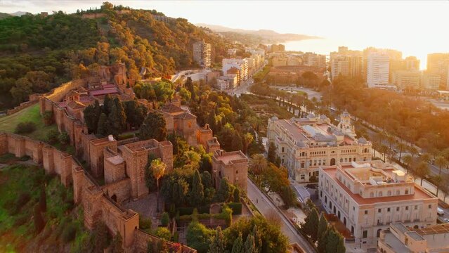 Aerial view of medieval Moorish castle of Alcazaba at sunrise in Malaga, Spain