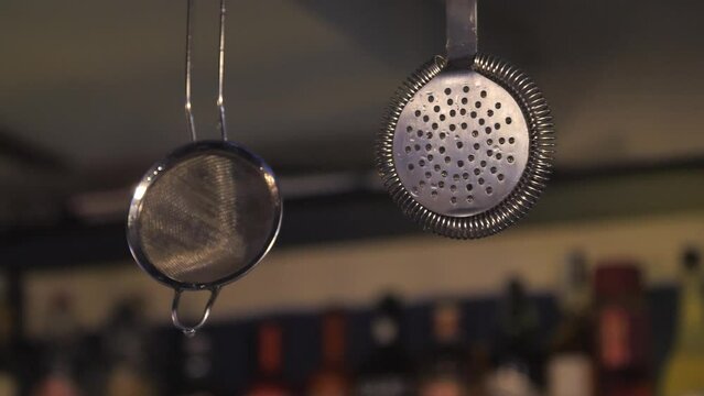 bartender's tool for making cocktails. strainer, a good tool for the job.