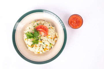fried rice with sauce in small container isolated on white background
