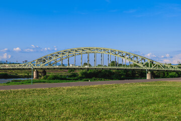 Fototapeta na wymiar Asahibashi Bridge over the Ishikari River at Asahikawa city, Hokkaido, Japan