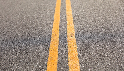 Double yellow line streets symbolize traffic regulation, no passing zones, road boundaries, safety,...