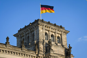 Fototapeta na wymiar Germany National Flag by the Wind on Reichstag Building in Berlin