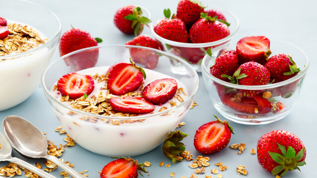 Yogurt and granola with strawberries for breakfast - generative ai