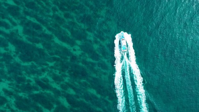 Aerial view of small fishing boat in the sea