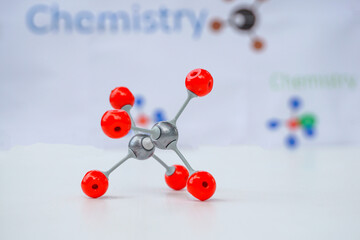 Simulate Shape of covalent molecules on english alphabet background Written in the text 