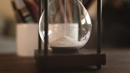 Hour Glass dropping sand corn