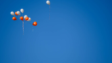 Ballons up in the blue sky