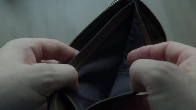 Man bankrupt arrears showing empty wallet with no money. Poverty finance business bankruptcy concept. Male debt businessman showing empty wallet. Financial crisis of getting into debt. no money on