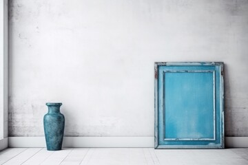both a blue rustic wood cabinet and an empty blank picture frame. Background of a white wall Generative AI