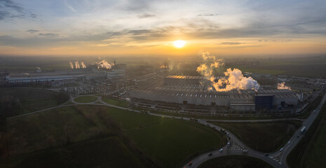 Cremona, Italy - January 2022 Drone aerial view of Arvedi working steel plant at dawn, industrial...