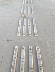 Fototapeta premium tactile warning strip for the visually impaired on the sidewalk. Tactile ground surface indicators for blind and visually impaired. Detectable warnings outside