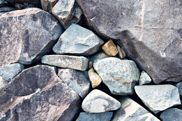 Stone walls are made up of alternating small and large stones.