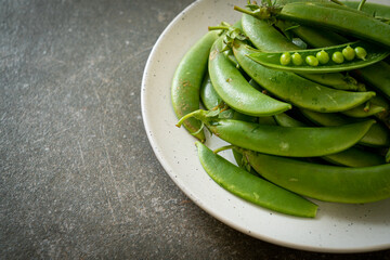 fresh sweet green peas on plate