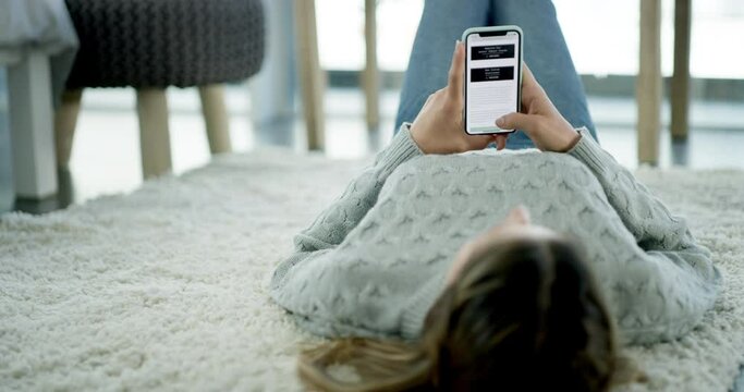 Woman, phone and browsing website while lying on living room floor for ecommerce at home. Female person relaxing and looking at homepage for online shopping, research or app on mobile smartphone