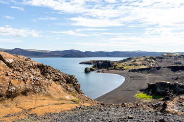 Black volcanic coastline of Kleifarvatn lake at Southern Peninsula in Iceland