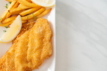 fish and chips - fried fish fillet with potatoes chips