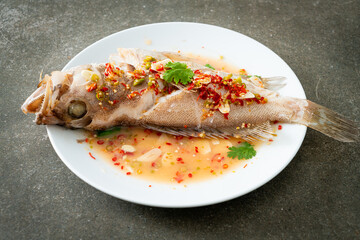 Steamed grouper fish with lime and chillies