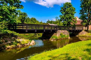 Fototapeta premium Old bridge over the river in countryside