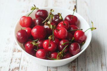 ripe fresh cherry in a bowl on table 