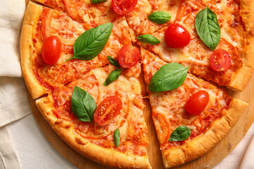 Board with tasty pizza margarita, closeup