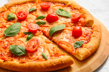 Board with tasty pizza margarita, closeup