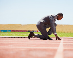 Start, race track and man in a suit for sport, running and fitness, cardio and speed practice. Starting line, ready and formal male sports runner at a stadium for challenge, performance and workout