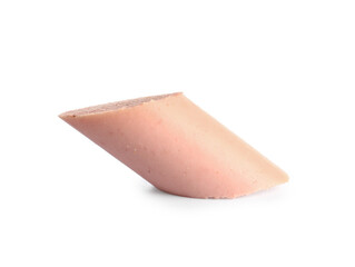 Slice of tasty thin sausage on white background