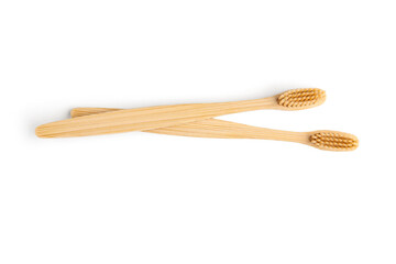 Bamboo toothbrushes on white background