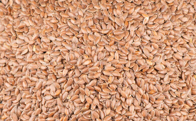 Linseeds. Flax seeds texture background. Flax seed heap background. Linseed pile closeup