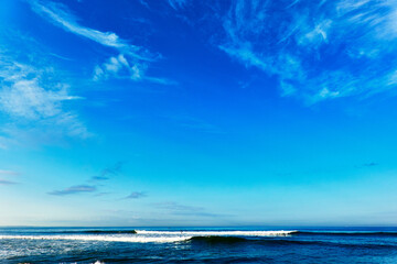 Scenic view of beach against blue sky