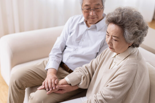 Senior man consoling his wife