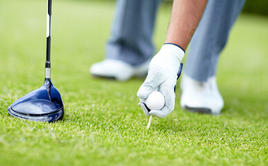 Golf, closeup of man with sports club and ball on the grass course outside. Training or practice, sports with equipment and hand of a male athlete golfer outside for competition or tournament