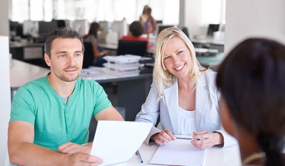 Paperwork, interview and happy business people, meeting clients and hiring or recruitment in creative office. Documents, resume or cv with woman and partner in HR talking and questions for onboarding