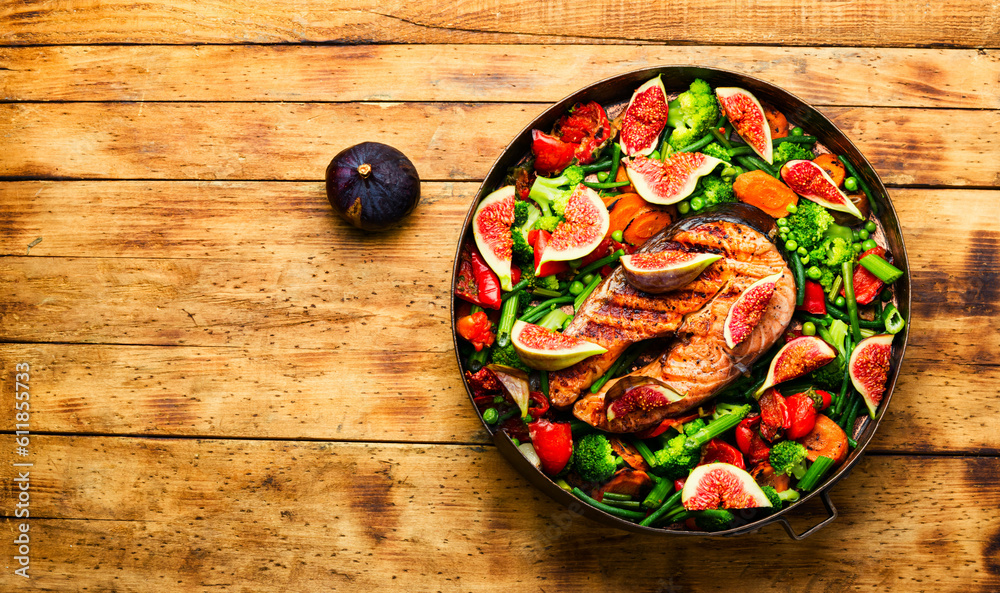 Wall mural trout steak fried with vegetables.