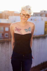 Punk, tattoo and portrait of woman in city for creative, urban and culture. Happy, pride and...