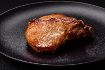 Delicious juicy pork or beef steak with salt, spices and herbs