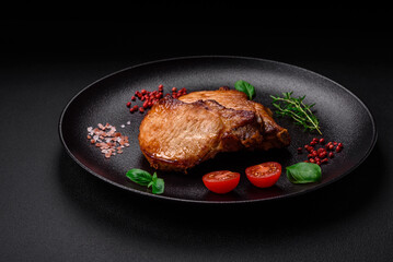 Delicious juicy pork or beef steak with salt, spices and herbs