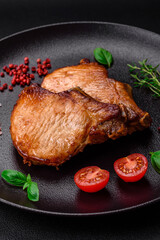 Delicious juicy pork or beef steak with salt, spices and herbs
