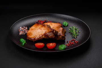 Delicious juicy pork or beef steak with salt, spices and herbs