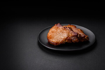 Delicious juicy pork or beef steak with salt, spices and herbs