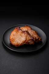 Delicious juicy pork or beef steak with salt, spices and herbs