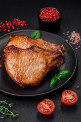 Delicious juicy pork or beef steak with salt, spices and herbs