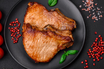 Delicious juicy pork or beef steak with salt, spices and herbs