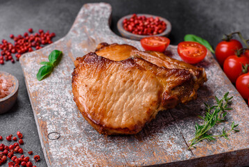 Delicious juicy pork or beef steak with salt, spices and herbs