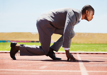 Business, start and black man with focus, race track and competition with determination, run and...