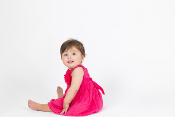 baby girl in a pink dress