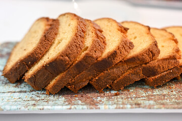 Sliices of sponge cake on a plate.All inclusieHotel breafast